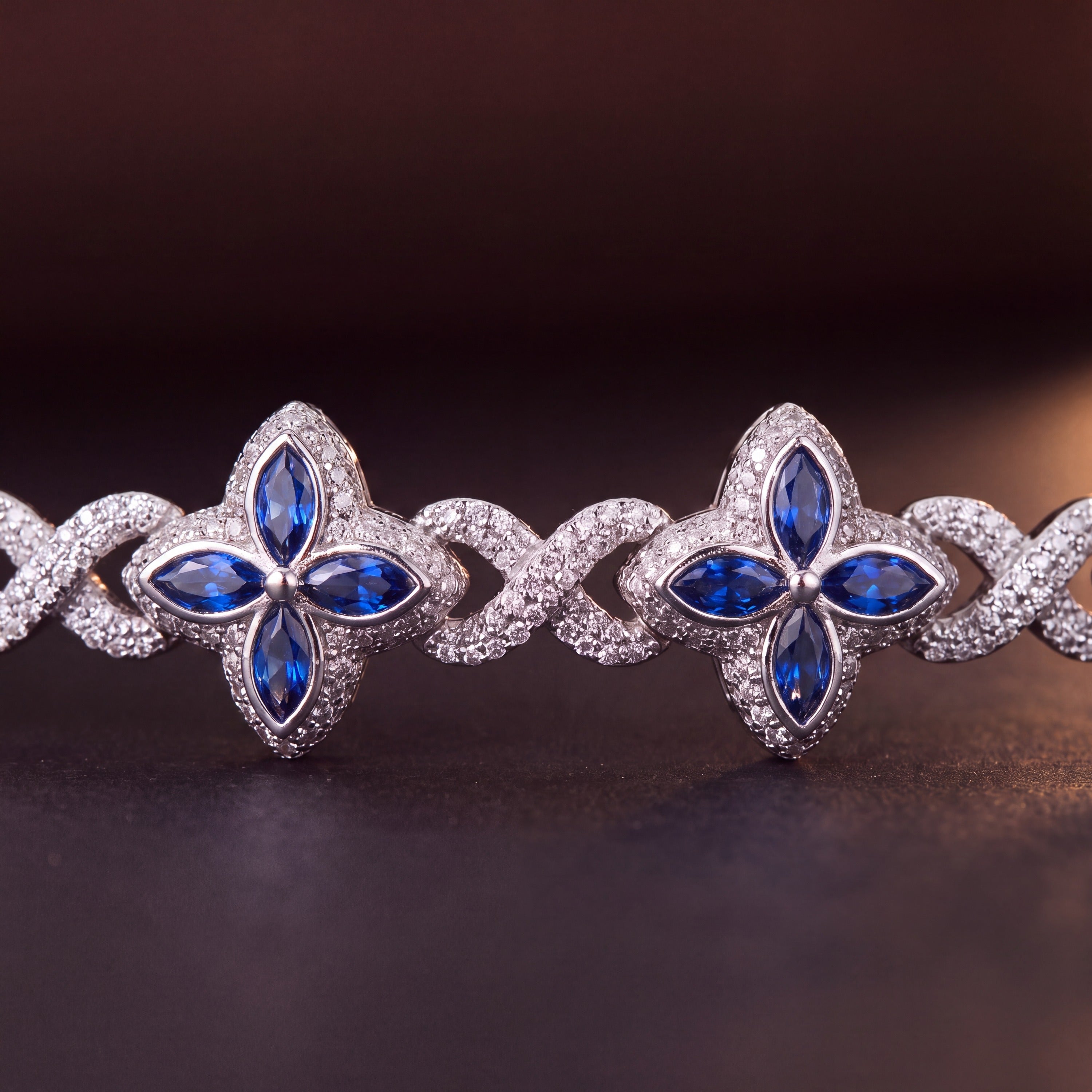 Macro of blue marquise petals framed by pave in the silver-tone colourway